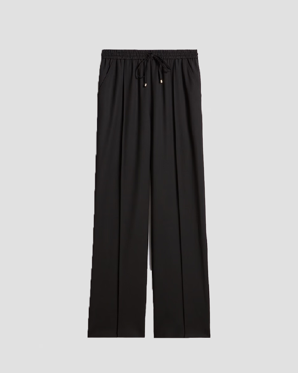 Sorte bukser i uldblanding med elastisk talje og snøre. Lige ben og lommer i siderne.