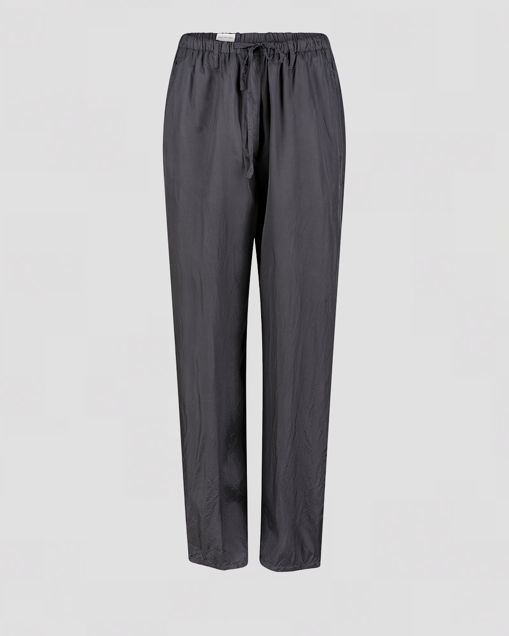 Mørke bukser med løstsiddende pasform, snoretræk i taljen, lige ben og elastiske manchetter.