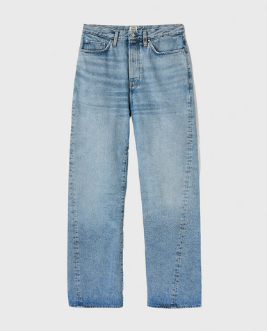 Lyseblå jeans med slidt look, lige ben, fem lommer og knaplukning.